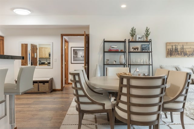 23110 US Highway 6 Unit 5074, Keystone, CO 80435 - dining space featuring wood finished floors, recessed lighting, and baseboards