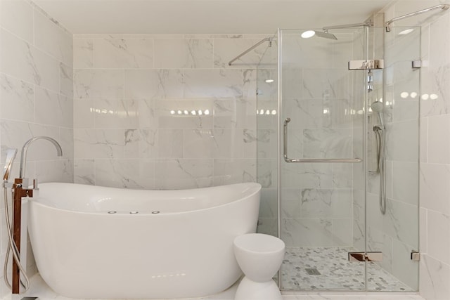 23110 US Highway 6 Unit 5074, Keystone, CO 80435 - bathroom with a soaking tub, a shower stall, and tile walls