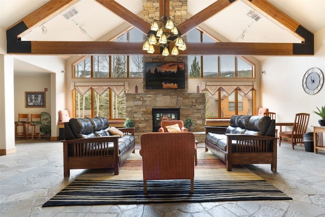 23110 US Highway 6 Unit 5074, Keystone, CO 80435 - living room with high vaulted ceiling, stone tile flooring, beamed ceiling, rail lighting, and a chandelier