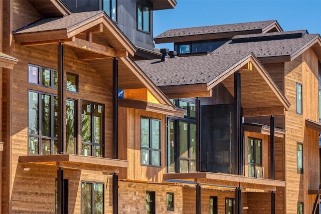 2948 Village Dr Unit 4, Steamboat Springs, CO 80487 - back of house featuring a shingled roof