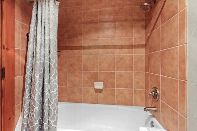 full bathroom with shower / bath combo with shower curtain