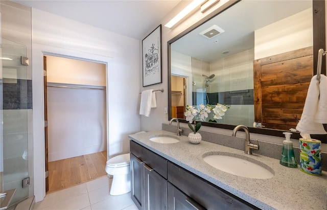 1090 Blue River Pkwy Unit 203, Silverthorne, CO 80498 - full bath featuring a stall shower, double vanity, toilet, and tile patterned floors