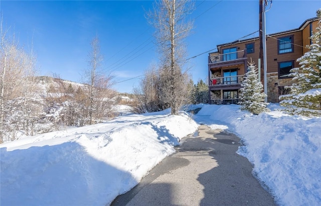 1090 Blue River Pkwy Unit 203, Silverthorne, CO 80498 - yard layered in snow with a balcony