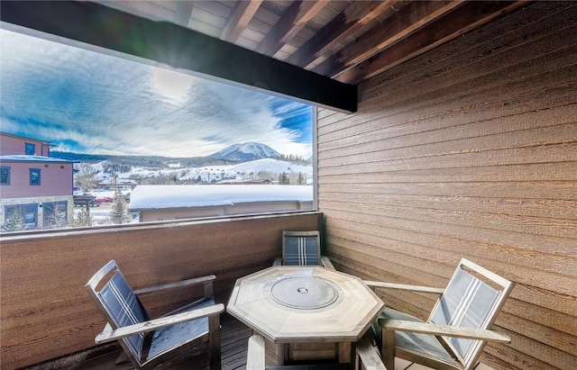 1090 Blue River Pkwy Unit 203, Silverthorne, CO 80498 - snow covered back of property featuring a mountain view