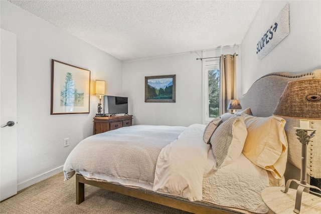 1179 Ski Hill Rd Unit 147, Breckenridge, CO 80424 - bedroom featuring carpet floors, a textured ceiling, and baseboards
