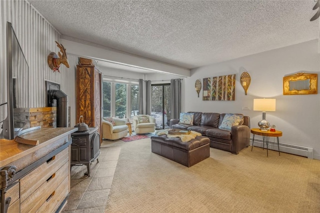 1179 Ski Hill Rd Unit 147, Breckenridge, CO 80424 - living area with baseboard heating, a wood stove, a textured ceiling, and light carpet