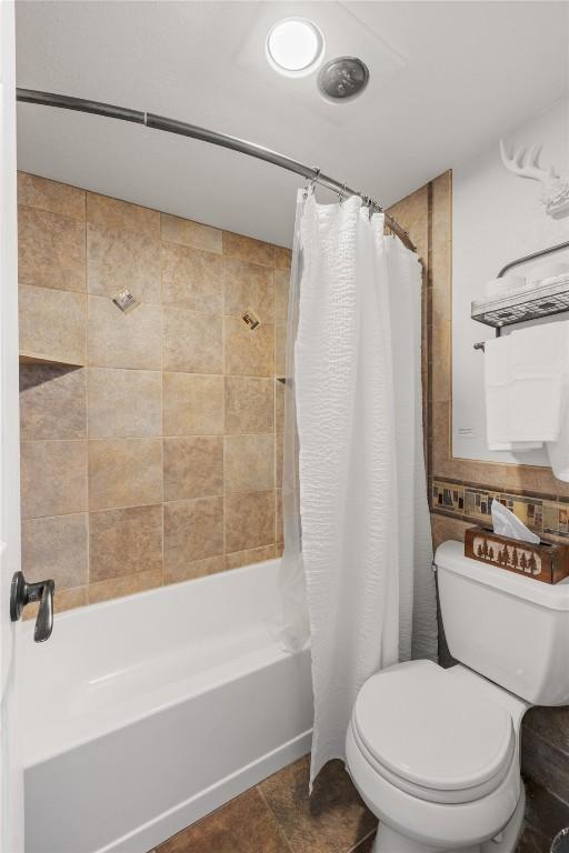 1179 Ski Hill Rd Unit 147, Breckenridge, CO 80424 - bathroom with shower / bath combo with shower curtain and toilet