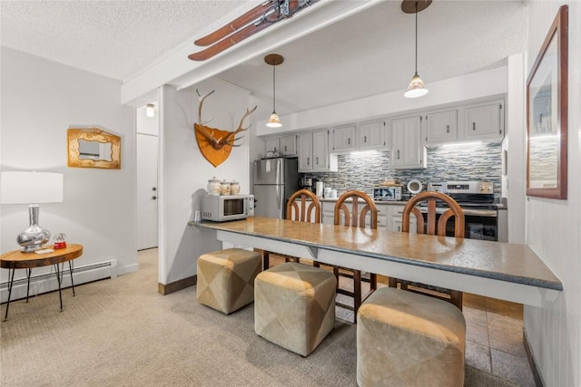 1179 Ski Hill Rd Unit 147, Breckenridge, CO 80424 - dining space with baseboards, lofted ceiling with beams, a textured ceiling, and light carpet