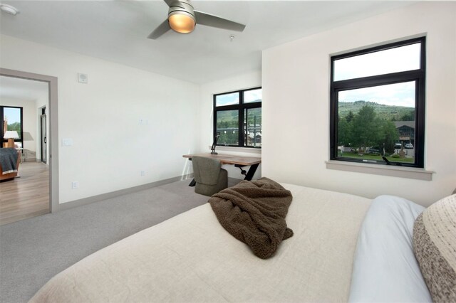 37 W 4th St Unit 201E, Silverthorne, CO 80498 - carpeted bedroom with multiple windows and a ceiling fan