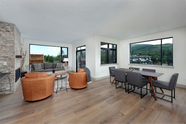 37 W 4th St Unit 201E, Silverthorne, CO 80498 - living room with wood finished floors, plenty of natural light, and a fireplace
