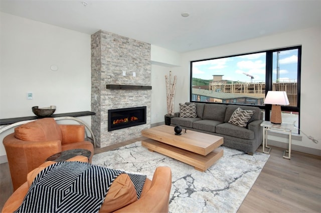 37 W 4th St Unit 201E, Silverthorne, CO 80498 - living room with wood finished floors and a fireplace