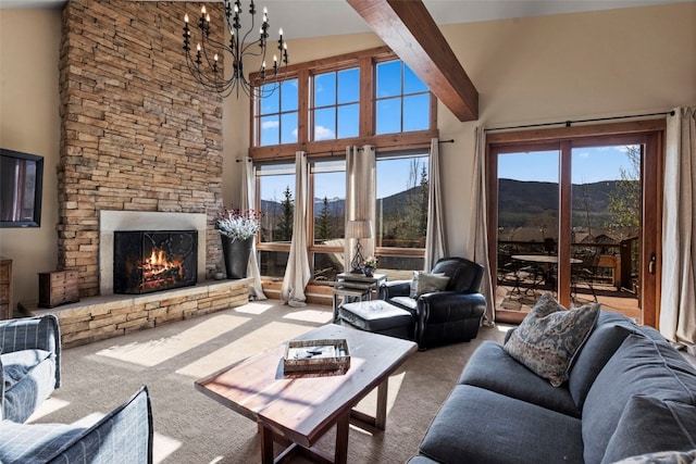 34 Snow Peak Ct, Dillon, CO 80435 - carpeted living area featuring high vaulted ceiling, a stone fireplace, a chandelier, a mountain view, and beamed ceiling