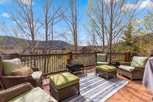 34 Snow Peak Ct, Dillon, CO 80435 - wooden terrace with outdoor lounge area and a mountain view