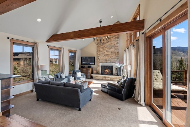 34 Snow Peak Ct, Dillon, CO 80435 - carpeted living room with a stone fireplace, beam ceiling, recessed lighting, a chandelier, and high vaulted ceiling