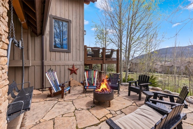 34 Snow Peak Ct, Dillon, CO 80435 - view of patio / terrace featuring a fire pit and a deck with mountain view