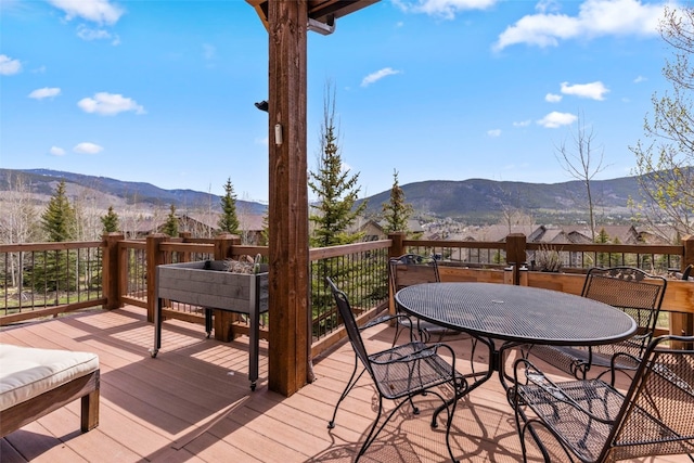 34 Snow Peak Ct, Dillon, CO 80435 - wooden terrace featuring a mountain view and outdoor dining space