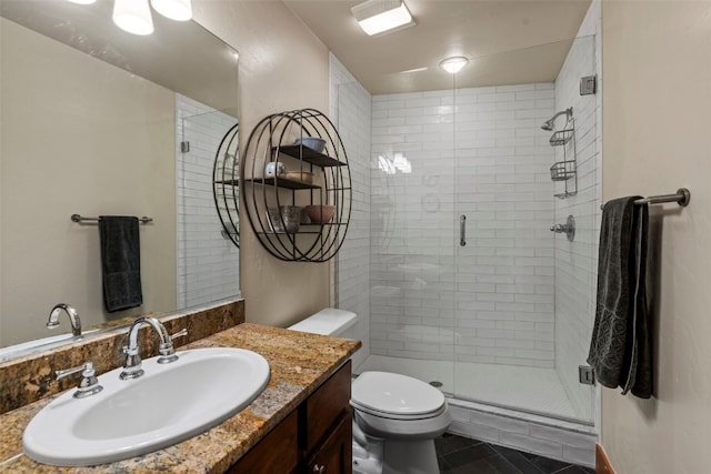 34 Snow Peak Ct, Dillon, CO 80435 - bathroom featuring vanity, a stall shower, toilet, and tile patterned flooring