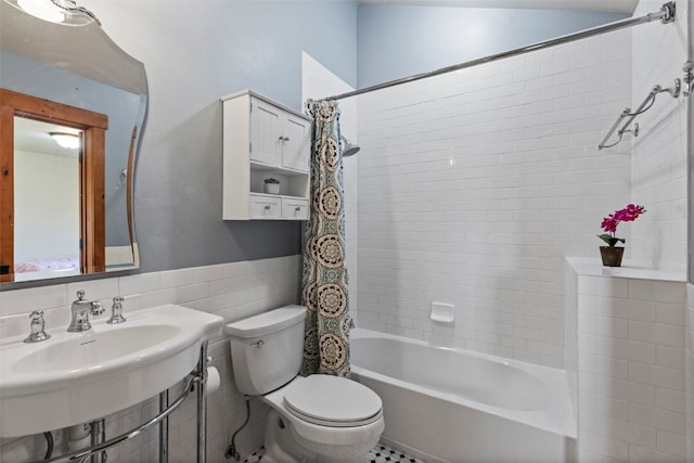 34 Snow Peak Ct, Dillon, CO 80435 - bathroom with toilet, shower / bath combo, tile walls, and a wainscoted wall
