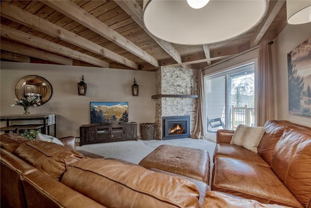 8500 Ryan Gulch Rd Unit G3, Silverthorne, CO 80498 - living area featuring carpet flooring, a fireplace, and wooden ceiling with exposed beams