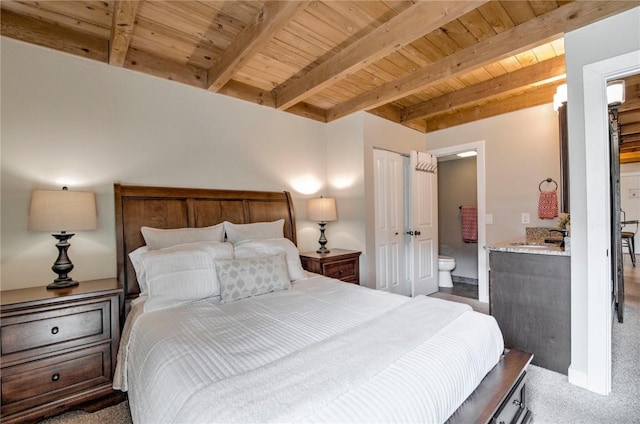8500 Ryan Gulch Rd Unit G3, Silverthorne, CO 80498 - carpeted bedroom with wood ceiling with exposed beams and connected bathroom