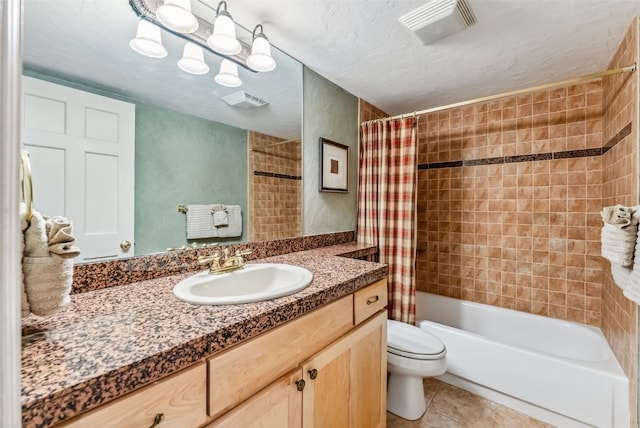 full bathroom featuring shower / bath combination with curtain, vanity, a textured ceiling, tile patterned flooring, and toilet