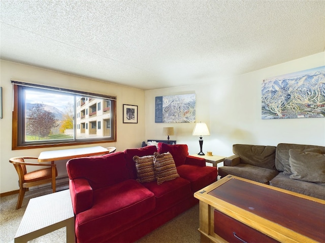 living room featuring carpet flooring and a textured ceiling