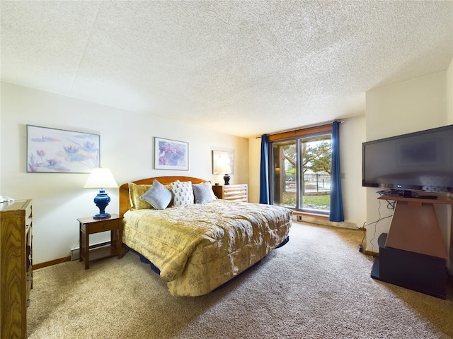 bedroom with carpet and a textured ceiling