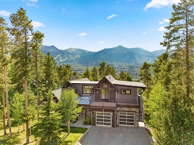 view of front of home featuring a mountain view and a garage