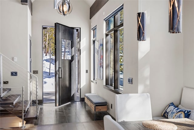 entryway featuring a high ceiling and a wealth of natural light