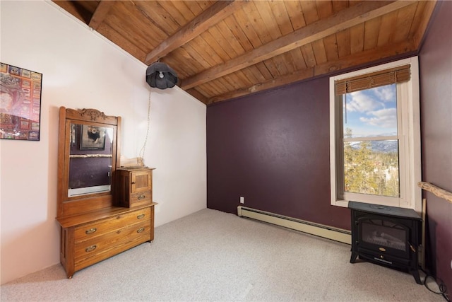 interior space featuring carpet floors, wood ceiling, baseboard heating, and beam ceiling