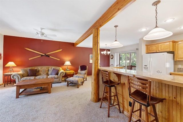 118 Lookout Ridge Dr Unit 118, Dillon, CO 80435 - living room with light colored carpet, recessed lighting, a chandelier, and a ceiling fan