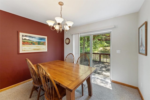 118 Lookout Ridge Dr Unit 118, Dillon, CO 80435 - carpeted dining space featuring a chandelier and baseboards