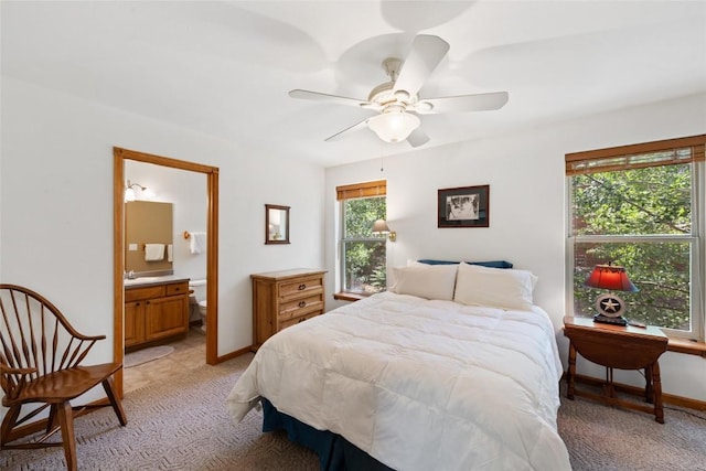 118 Lookout Ridge Dr Unit 118, Dillon, CO 80435 - bedroom featuring light carpet, connected bathroom, and ceiling fan