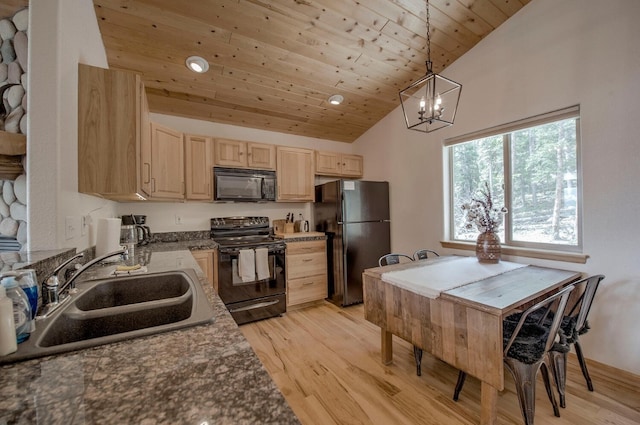 kitchen with light brown cabinets, black appliances, a sink, and light wood finished floors