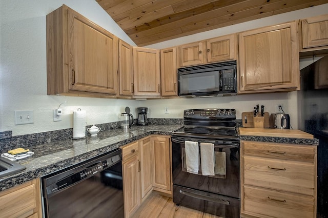 kitchen featuring light wood finished floors, vaulted ceiling, light brown cabinetry, and black appliances