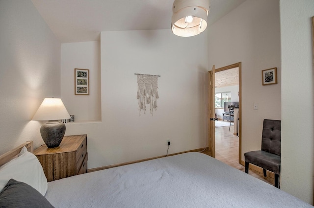 carpeted bedroom featuring baseboards