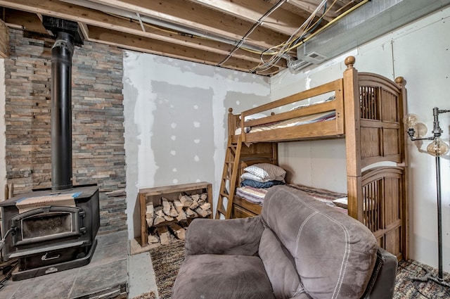 bedroom featuring a wood stove
