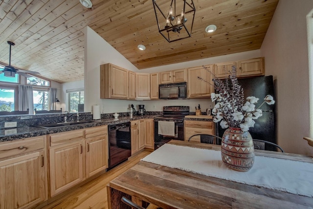 kitchen with vaulted ceiling, light brown cabinetry, a sink, and black appliances