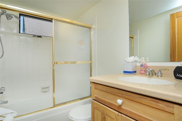 full bathroom featuring toilet, vanity, and enclosed tub / shower combo