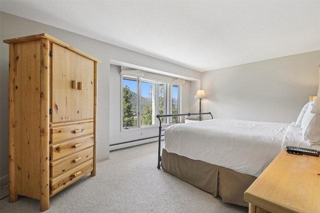 22097 Saints John Rd Unit 2537, Keystone, CO 80435 - bedroom with a baseboard radiator and light colored carpet