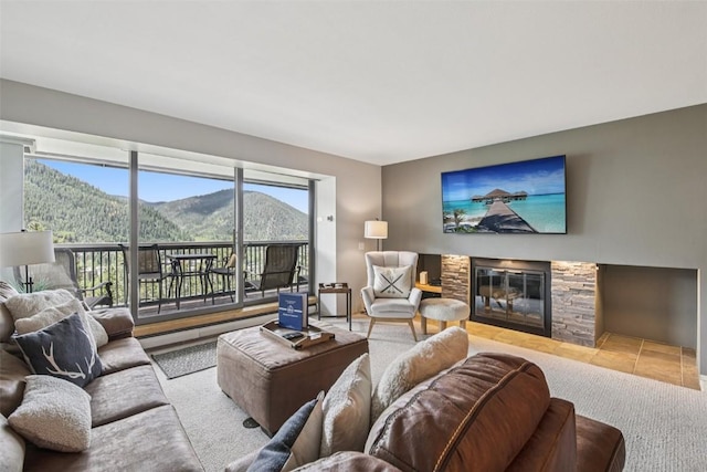 22097 Saints John Rd Unit 2537, Keystone, CO 80435 - living room featuring plenty of natural light, a stone fireplace, and tile patterned floors