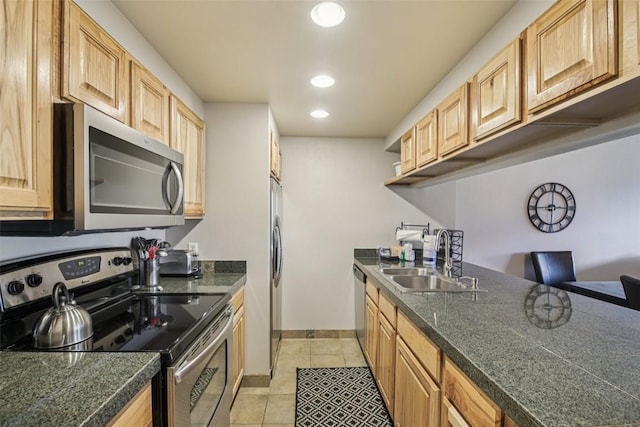 22097 Saints John Rd Unit 2537, Keystone, CO 80435 - kitchen with stainless steel appliances, light tile patterned floors, recessed lighting, and light brown cabinetry