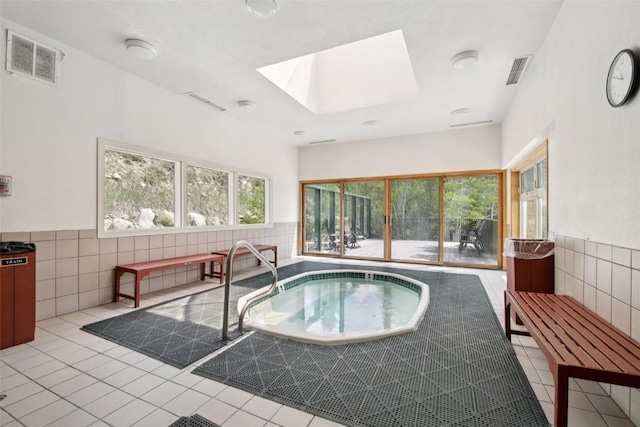 22097 Saints John Rd Unit 2537, Keystone, CO 80435 - view of pool featuring a skylight and an in-ground hot tub