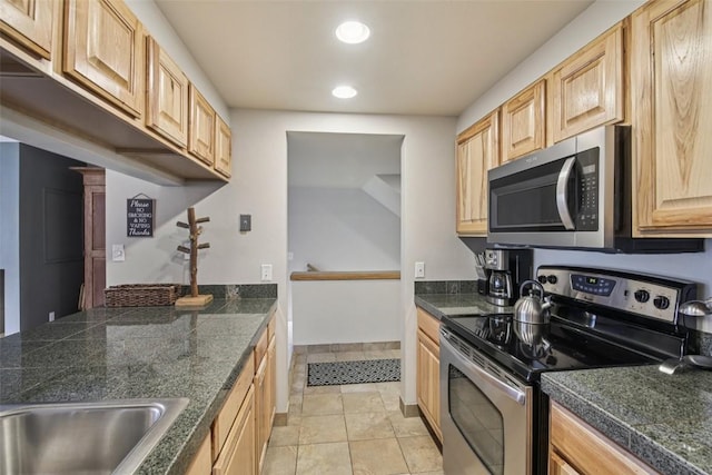 22097 Saints John Rd Unit 2537, Keystone, CO 80435 - kitchen with stainless steel appliances, tile counters, light brown cabinetry, and recessed lighting