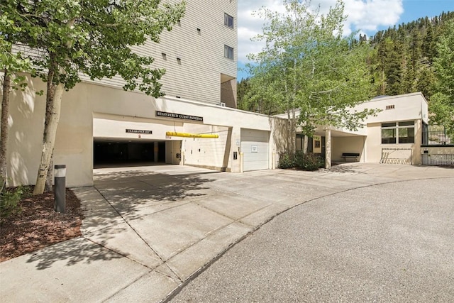 22097 Saints John Rd Unit 2537, Keystone, CO 80435 - view of home's exterior with concrete driveway and a garage