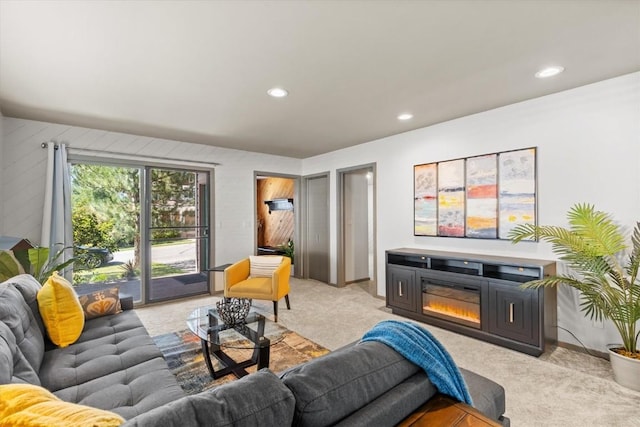 818 Broad St, Steamboat Springs, CO 80487 - living area with light colored carpet, a glass covered fireplace, recessed lighting, and baseboards