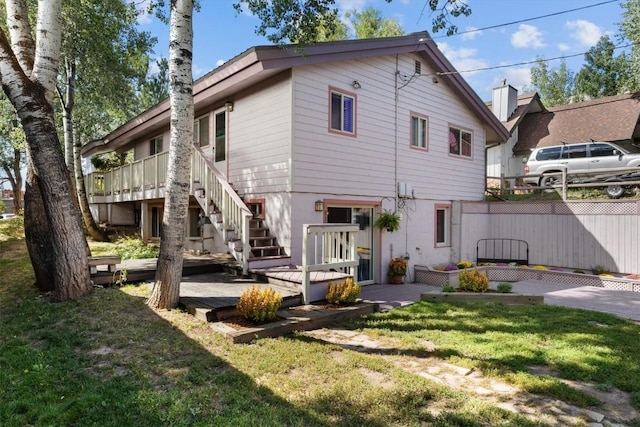818 Broad St, Steamboat Springs, CO 80487 - rear view of property featuring a deck and stairway