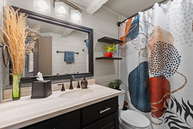 818 Broad St, Steamboat Springs, CO 80487 - bathroom featuring vanity, toilet, a shower with curtain, and wood walls