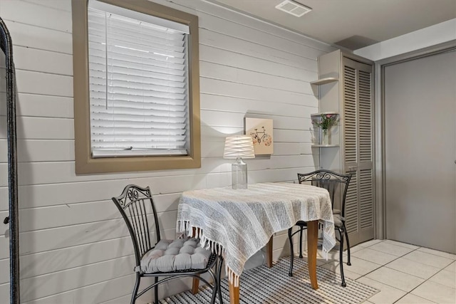 818 Broad St, Steamboat Springs, CO 80487 - tiled dining space featuring wood walls