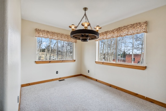 316 3rd St, Fairplay, CO 80440 - empty room featuring a chandelier, carpet, and baseboards